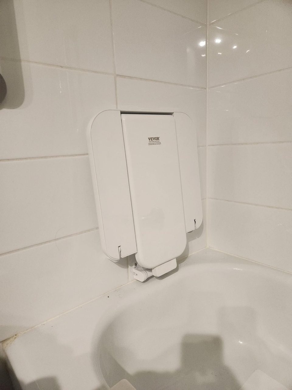 A fold-down shower safety seat fitted for a safe, supported wash after a hospital stay